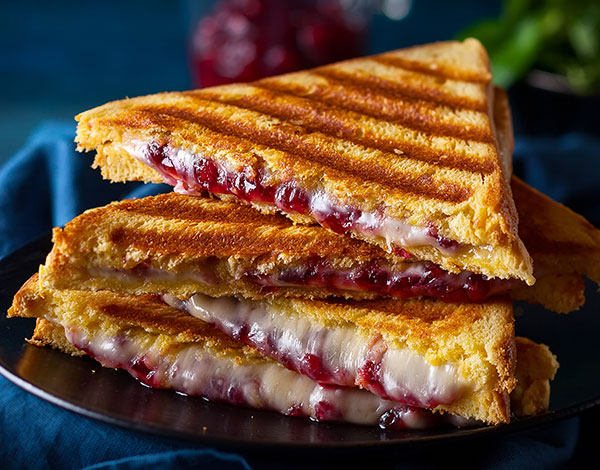 Panini with Brie, Cranberry Sauce and Caramelized Onions