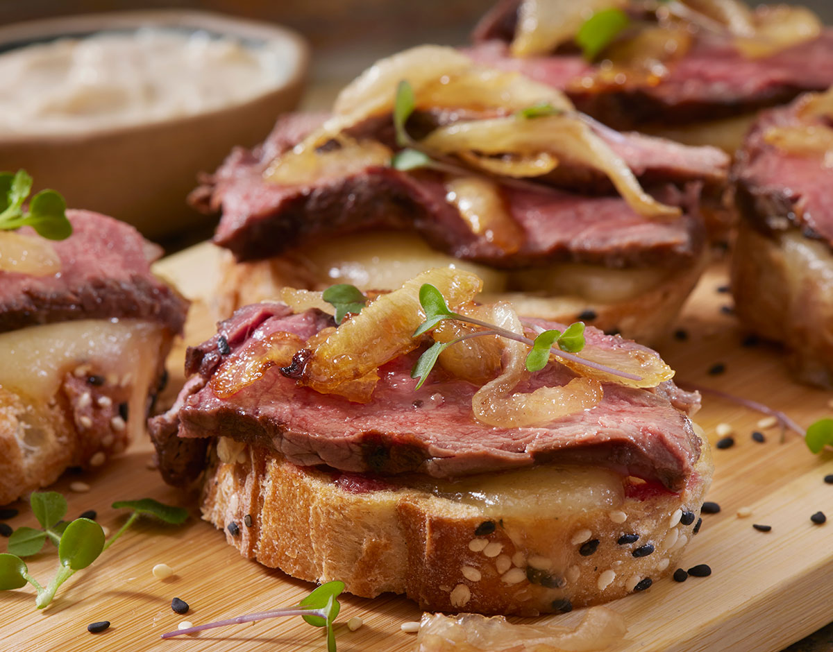 Beef Tenderloin Crostini with Caramelized Onions and Brie