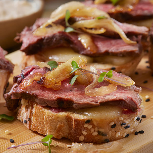 Beef Tenderloin Crostini with Caramelized Onions and Brie